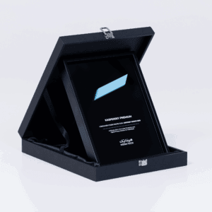 Angled view of the Kaspersky Premium Editors' Choice 2025 award plaque displayed in its presentation box, highlighting the design and engraving
